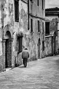 old italian man strolling the street in italy