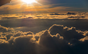 sun rays over clouds at 33,000 feet