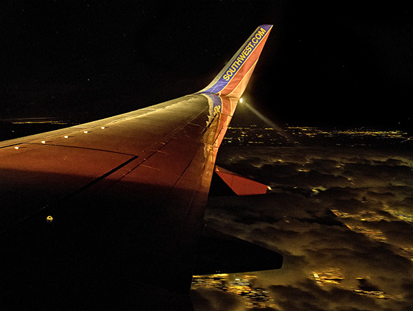 southwest wing over clouds