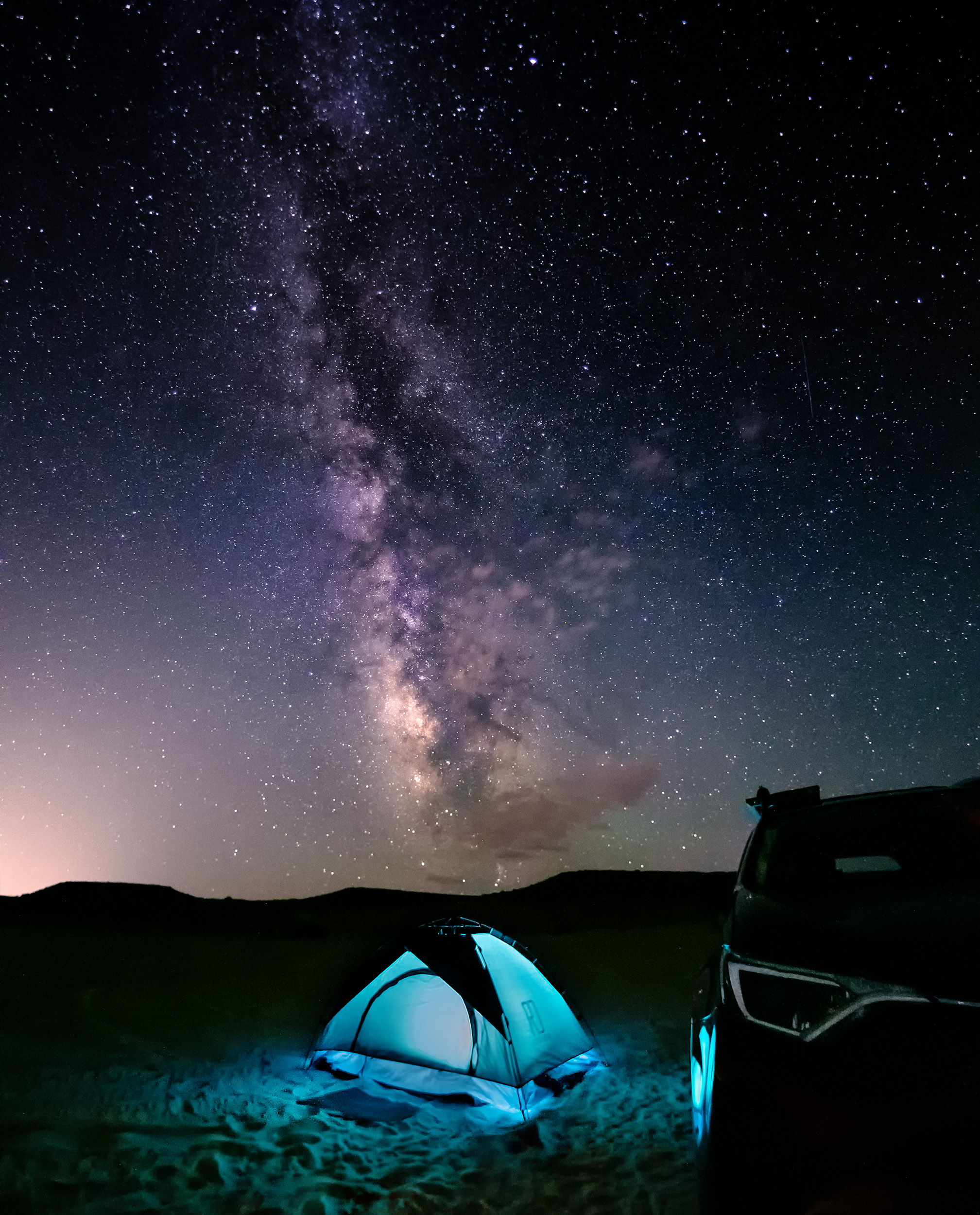 tent under milky way skies